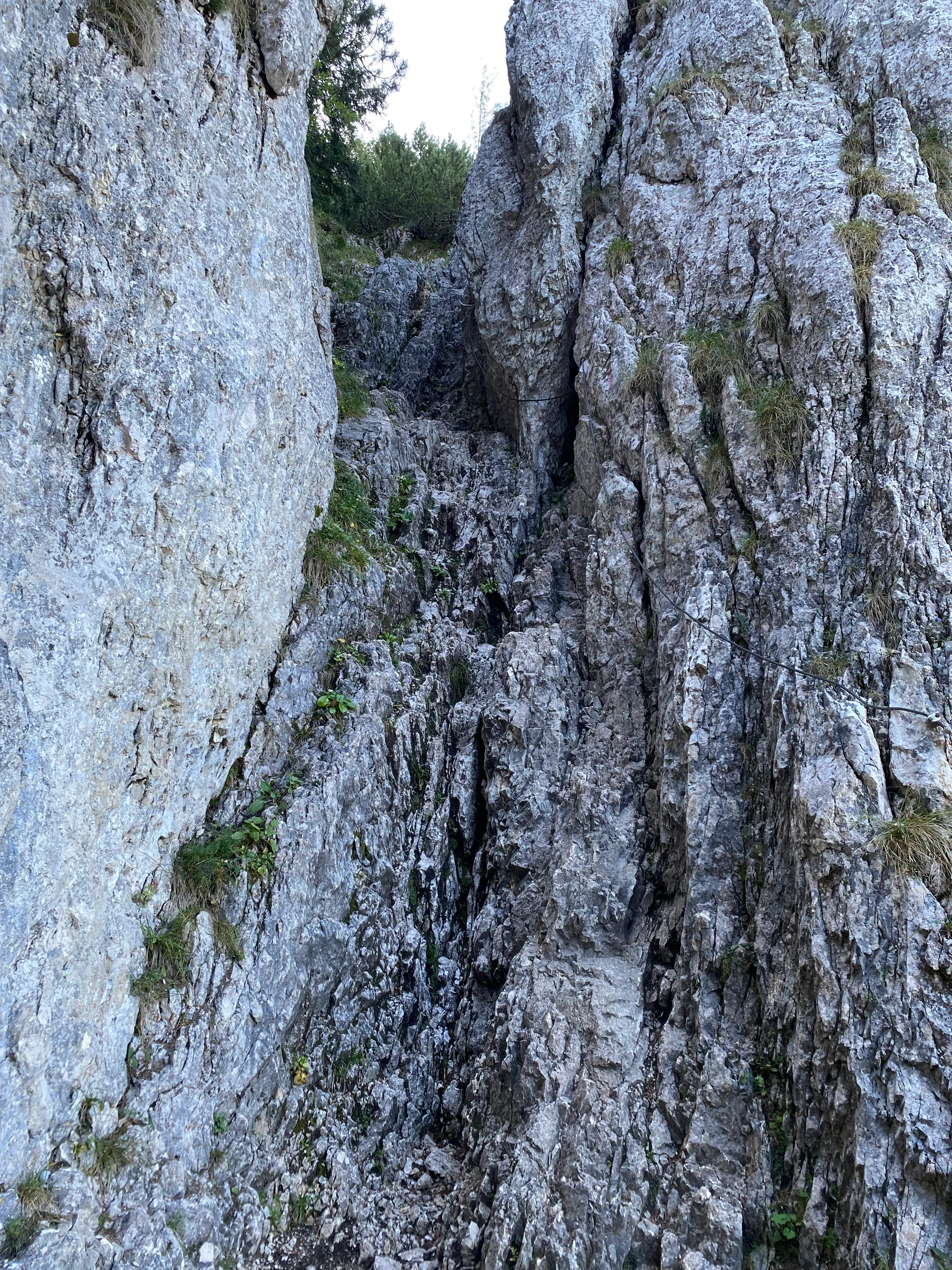 Climbing using cable for assistance